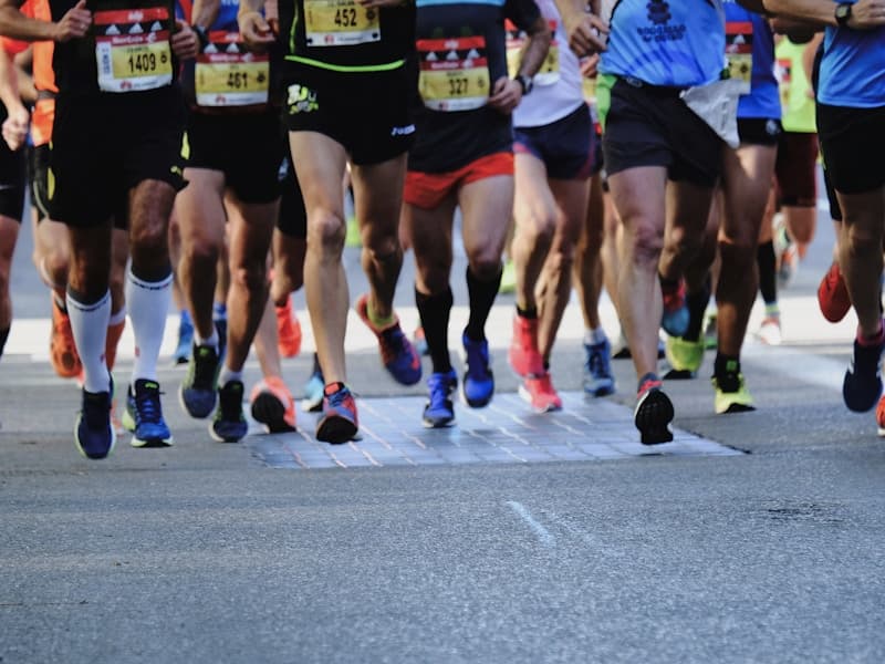 Masters runners at the start of a road race
